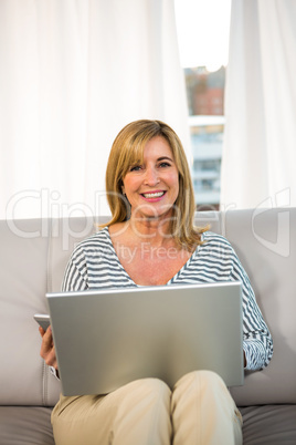 Woman sitting on her sofa