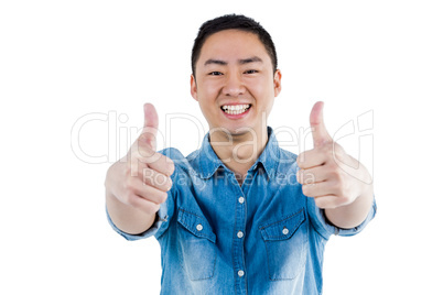 Portait of man showing thumbs up