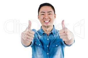Portait of man showing thumbs up