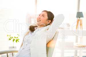 Smiling businesswoman relaxing herself