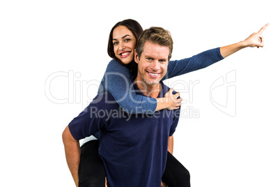 Portrait of happy man carrying girlfriend