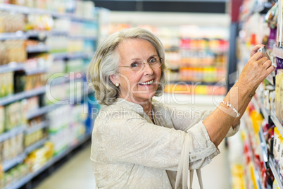 Senior woman buying food