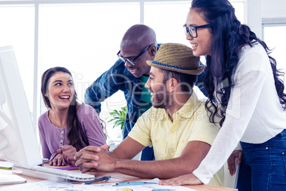 Business people laughing at desk