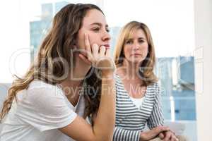 Daughter thinking with mother