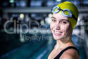 Portrait of a woman swimmer looking the camera