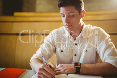 Concentrated male student during class