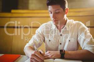 Concentrated male student during class