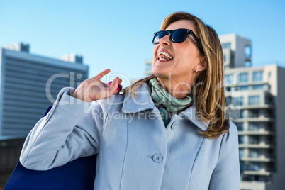 Woman laughing in town