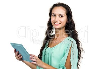 Smiling woman holding tablet and looking at camera