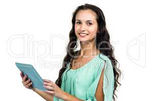 Smiling woman holding tablet and looking at camera