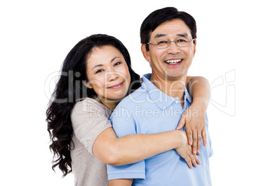 Smiling couple holding each other