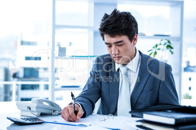 Concentrated asian businessman