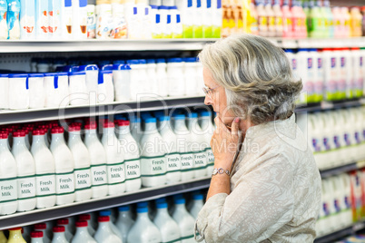 Senior woman buying milk