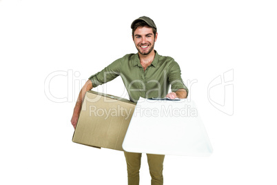 Handsome postman holding clipboard