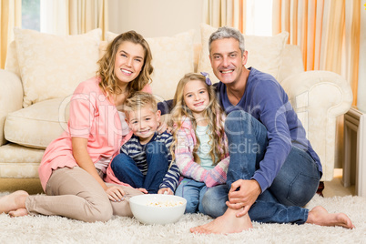 Happy family enjoying a movie together