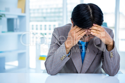 Worried businessman at his desk