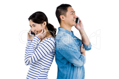Happy couple talking on phone