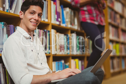 Male student working on floor