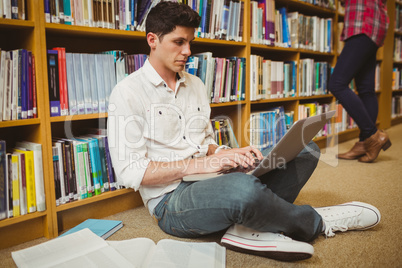 Male student working on floor