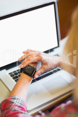 Female student using smart watch