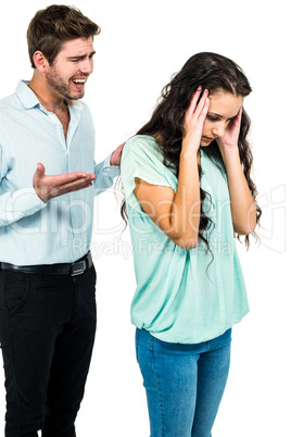 Unsmiling couple arguing