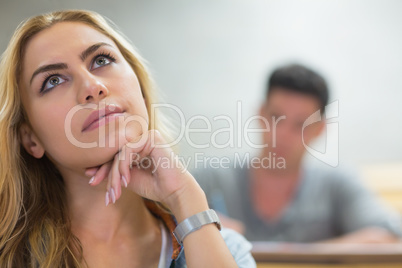 Thoughtful female student during class