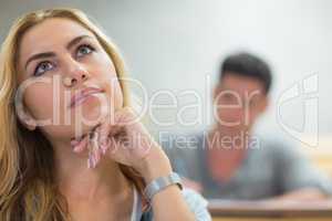 Thoughtful female student during class
