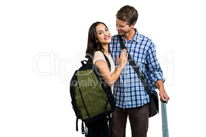 Couple with bags embracing each other