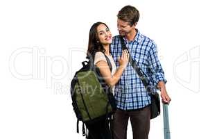 Couple with bags embracing each other