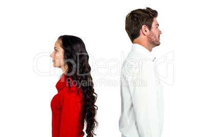Couple standing back to back after arguing