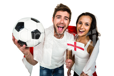 High angle view of couple holding football and English flag