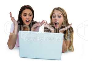 Two girls using a laptop