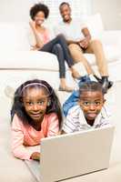 Happy kids using laptop pc
