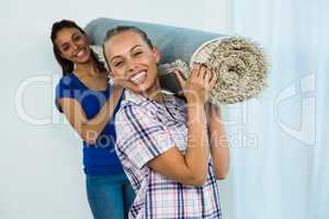 Friends holding a carpet