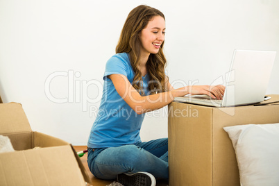 Girl typing on her laptop