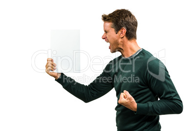 Angry man holding document