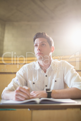 Concentrated male student during class