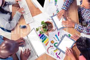 Business people using technologies at desk in office