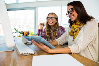 Two girls work at office