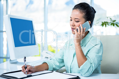 Smiling businesswoman having a phone call