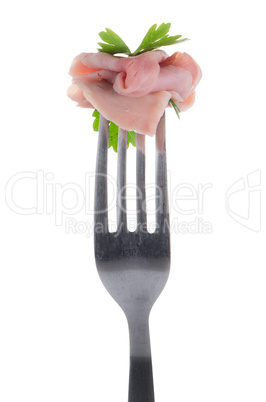 Slice of ham skewered on a fork