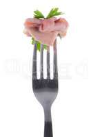 Slice of ham skewered on a fork