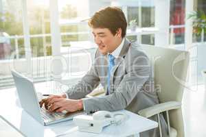 Asian businessman using his computer