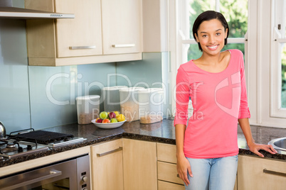 Portrait of smiling brunette in kitchen