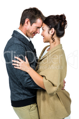 Side view of romantic couple hugging