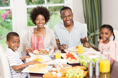 Portrait of happy family eating together