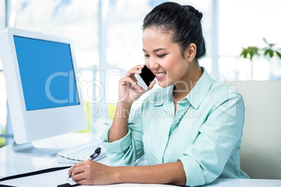 Smiling businesswoman having a phone call