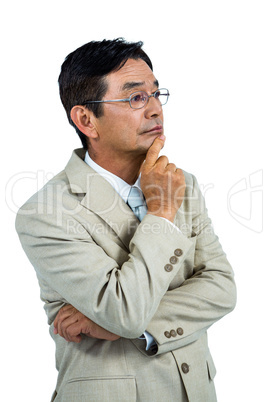 Thoughtful businessman looking away