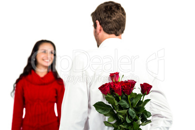 Man holding bouquet of roses with girlfriend