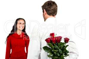 Man holding bouquet of roses with girlfriend